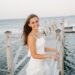 high school senior picture of a girl on a cape cod pier